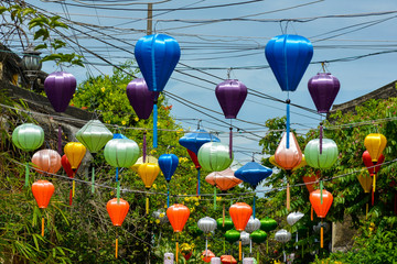 Fototapeta na wymiar Multicolored lanterns decorating a street in Hoi An, Vietnam