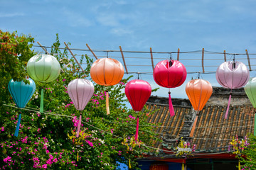 Fototapeta na wymiar Colorful paper lanterns decorating a street in Hoi An, Vietnam