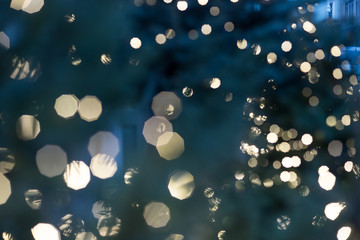 Christmas lights. Bokeh lights against a dark background.