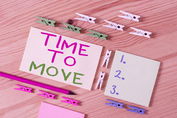 Text sign showing Time To Move. Business photo showcasing Best period to transfer Relocation Change the current path Colored clothespin papers empty reminder wooden floor background office