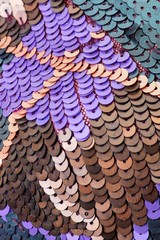 Fabric with sequins and sequins of bright colors. Fashion glitter fabric, sequins. Shiny surface