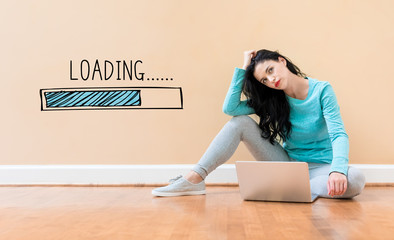 Loading concept with young woman using a laptop computer