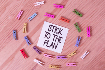 Writing note showing Stick To The Plan. Business concept for To adhere to some plan and not deviate...