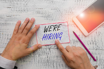Writing note showing We Re Hiring. Business concept for recently you employ someone or pay someone...