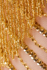 Fabric with sequins and sequins of bright colors. Fashion glitter fabric, sequins. Shiny surface
