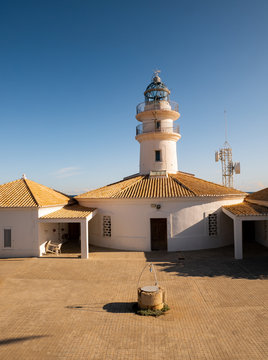 Cullera lighthouse on blue and clear sky background