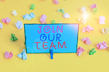 Text sign showing Join Our Team. Business photo showcasing Allied Associate Work with us New Employee Hired Enlist Colored crumpled papers empty reminder white floor background clothespin