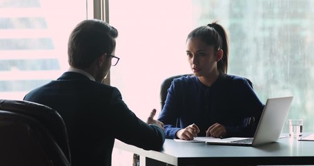 Female employer manager make financial deal handshake customer at meeting