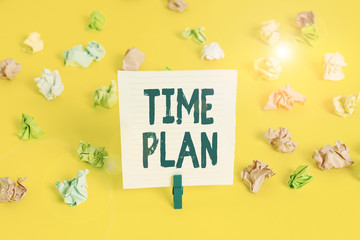 Word writing text Time Plan. Business photo showcasing a system for paying for goods by installments or in regular analysisner Colored crumpled papers empty reminder white floor background clothespin