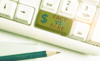 Handwriting text Fact Vs Fake. Conceptual photo Rivalry or products or information originaly made...