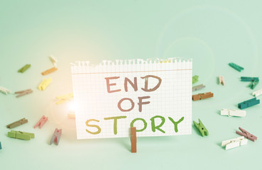 Word writing text End Of Story. Business photo showcasing Emphasize that nothing to add Literature writing Journalism Colored clothespin rectangle square shaped paper light blue background