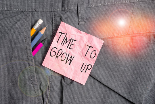 Text sign showing Time To Grow Up. Business photo text knowing that you are mature demonstrating have responsibility Writing equipment and pink note paper inside pocket of man work trousers