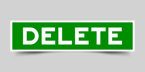 Fototapeta premium Label sticker in green color square shape as word delete on white background