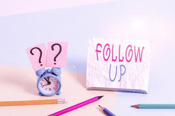 Writing note showing Follow Up. Business concept for Additional info or any activity that needs to...