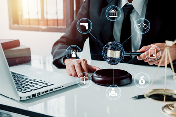 Justice and law concept.Male judge in a courtroom with the gavel and lawyer icon.