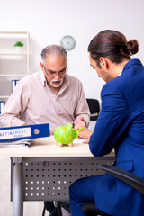 Financial advisor giving retirement advice to old man