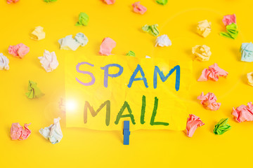 Handwriting text writing Spam Mail. Conceptual photo Intrusive advertising Inappropriate messages sent on the Internet Colored crumpled papers empty reminder white floor background clothespin