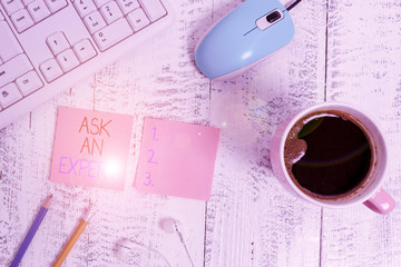 Text sign showing Ask An Expert. Business photo showcasing Superior Reliable Ace Virtuoso Curapp storeity Authority Geek technological devices colored reminder paper office supplies keyboard mouse