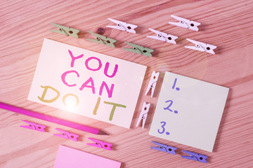 Text sign showing You Can Do It. Business photo showcasing Bring it On Believing to oneself Give a try Take the chance Colored clothespin papers empty reminder wooden floor background office