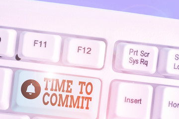 Writing note showing Time To Commit. Business concept for Engagement or obligation that restricts...