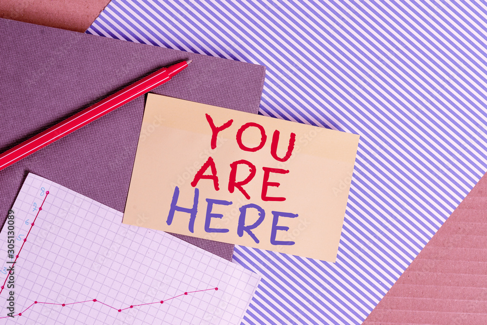 Poster conceptual hand writing showing you are here. concept meaning this is your location reference point 