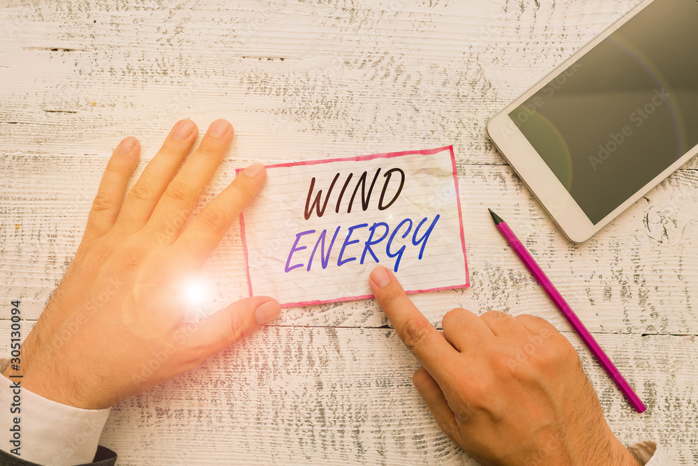Aufkleber writing note showing wind energy. business concept for the process by which wind is used to generate