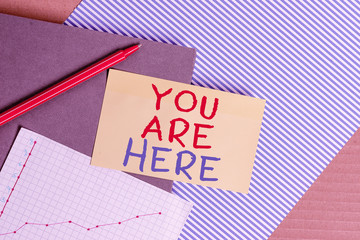 Conceptual hand writing showing You Are Here. Concept meaning This is your location reference point...