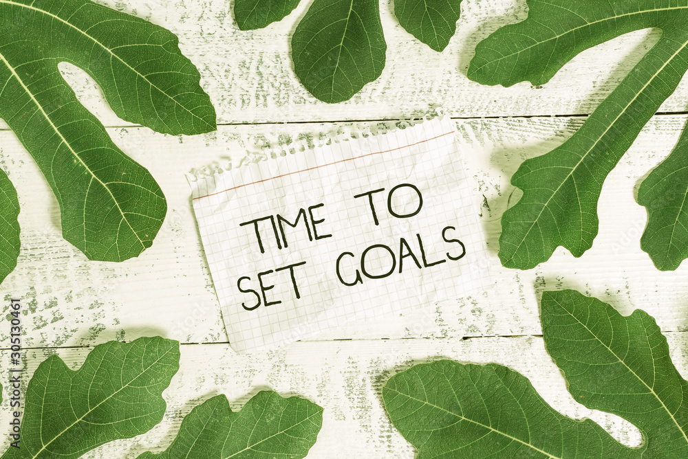 Aufkleber writing note showing time to set goals. business concept for desired objective wanted to accomplish 