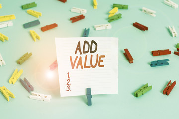 Word writing text Add Value. Business photo showcasing an improvement or addition to something that makes it worth more Colored clothespin papers empty reminder blue floor background office pin