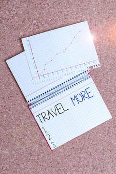 Text sign showing Travel More. Business photo showcasing To make a journey often especially on long distance trip Desk notebook paper office cardboard paperboard study supplies table chart