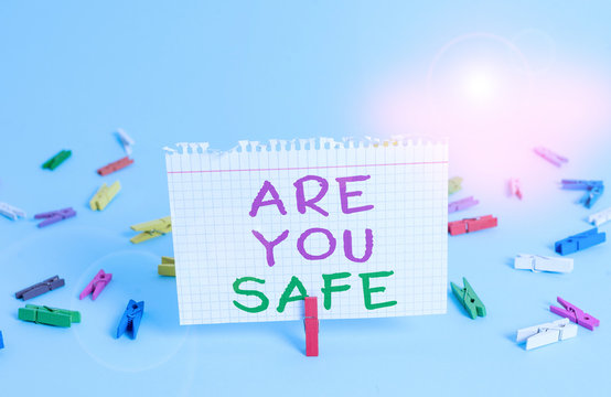 Word writing text Are You Safe. Business photo showcasing Free from danger Not anticipating any Harm Hurt physically Colored clothespin rectangle square shaped paper light blue background