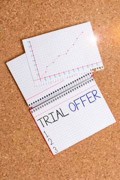 Text sign showing Trial Offer. Business photo showcasing A temporary free or discounted offer of a product or services Desk notebook paper office cardboard paperboard study supplies table chart