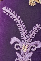 Fabric with sequins and sequins of bright colors. Fashion glitter fabric, sequins. Shiny surface