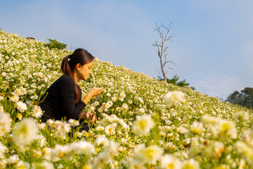 Asian woman standing soulful atmosphere .