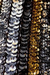 Fabric with sequins and sequins of bright colors. Fashion glitter fabric, sequins. Shiny surface