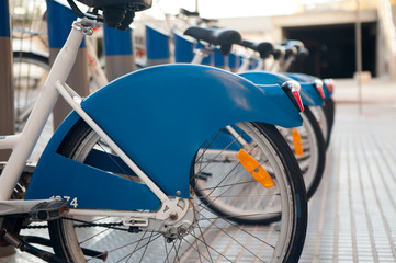 blue rental bicycles with blue advertising space