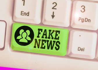 Conceptual hand writing showing Fake News. Concept meaning Giving information to showing that is...