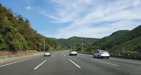 a motorized highway in Korea. the back of a running car.