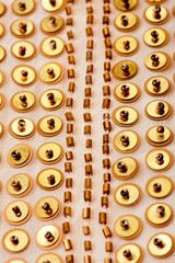 Fototapeta premium Fabric with sequins and sequins of bright colors. Fashion glitter fabric, sequins. Shiny surface
