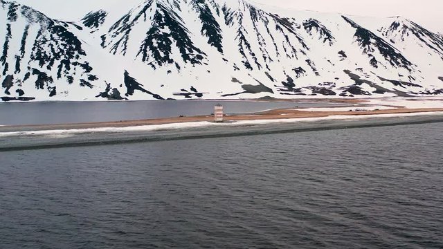 Old beacon on the sea spit. Place of shooting northerly coast of the Bering Sea, Chukchi region, Russia.
