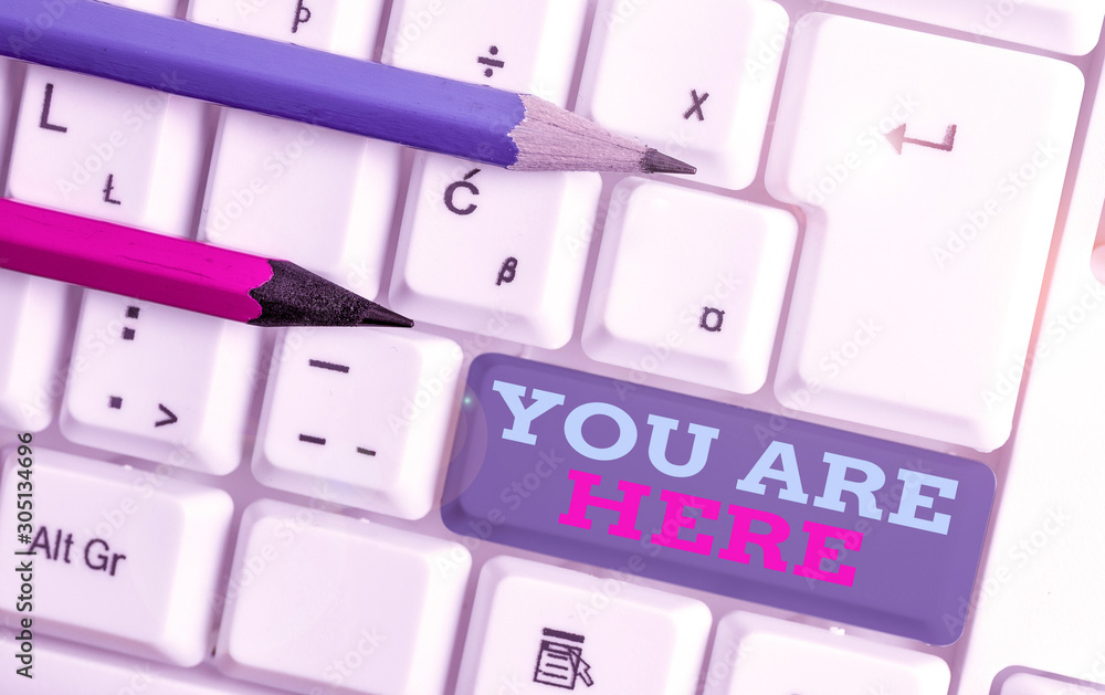 Poster conceptual hand writing showing you are here. concept meaning this is your location reference point 
