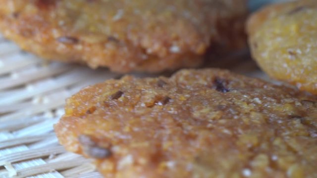 Cinematic closed up shot of Vada (Vadai, Vadei) is a traditional South indians food. this Hot and spicy fritters are perfect as snacks and are hugely popular among malaysians