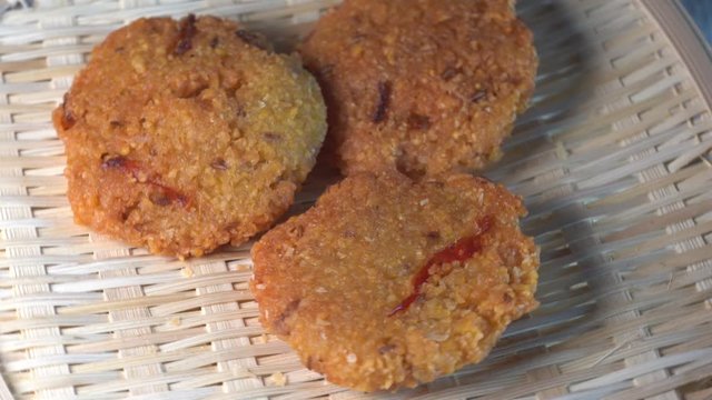 Cinematic closed up shot of Vada (Vadai, Vadei) is a traditional South indians food. this Hot and spicy fritters are perfect as snacks and are hugely popular among malaysians