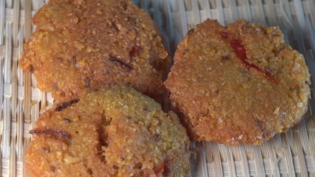 Cinematic closed up shot of Vada (Vadai, Vadei) is a traditional South indians food. this Hot and spicy fritters are perfect as snacks and are hugely popular among malaysians
