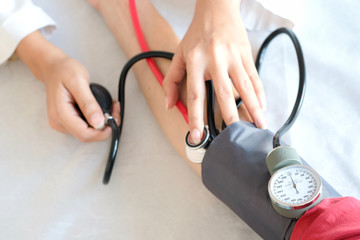 Doctor woman check blood pressure monitor and heart rate monitor pressure gauge. Health care and  Medical concept