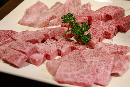 raw meat on a cutting board isolated on white