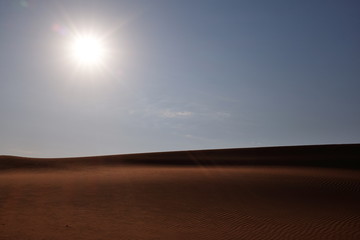 Sun and a desert landscape. Solar and Renewable Energy concept 