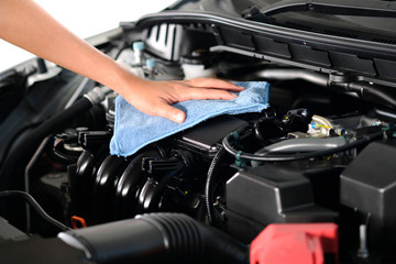 Plakat hand of a man holding a blue cloth caring, maintenance car and cleaning And engine car room