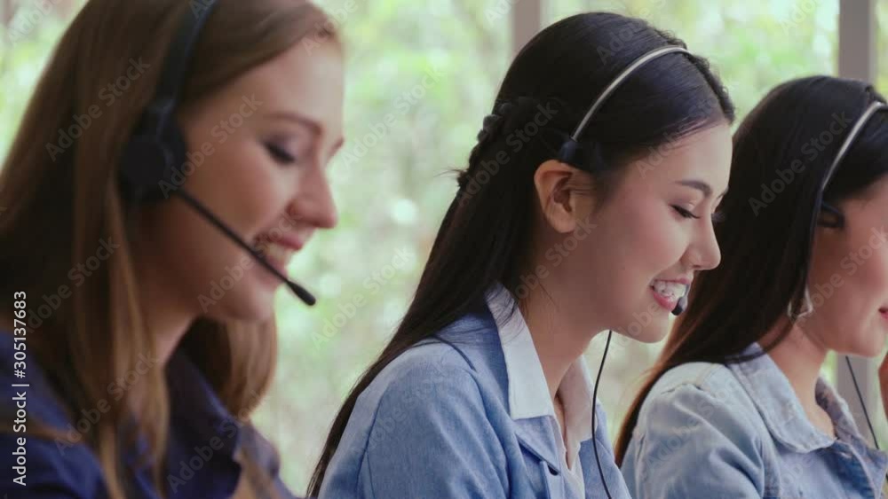 Aufkleber customer support agent or call center with headset works on desktop computer while supporting the cu