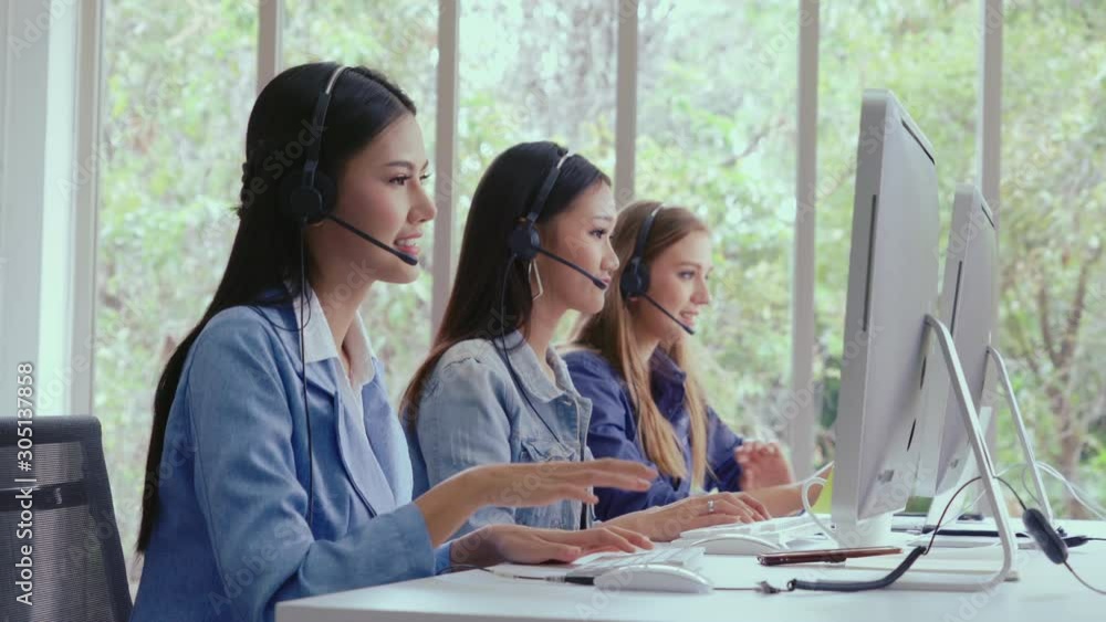 Aufkleber customer support agent or call center with headset works on desktop computer while supporting the cu